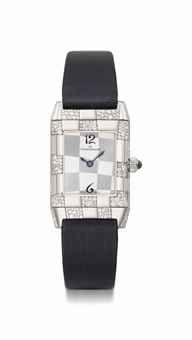 Jaeger-LeCoultre. A lady's fine, rare and attractive 18K white gold and diamond-set reversible wristwatch with unique diamond snow setting