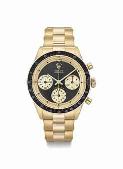 Rolex. A fine, extremely rare and attractive 18K gold chronograph wristwatch with black “John Player Special Paul Newman” dial