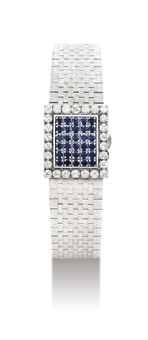 PATEK PHILIPPE. A LADY’S FINE 18K WHITE GOLD, DIAMOND AND SAPPHIRE-SET SQUARE BRACELET WATCH WITH CONCEALED DIAL