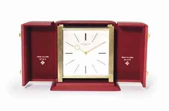 Patek Philippe. A Fine Gilt Brass Square-Shaped Solar Powered Desk Clock