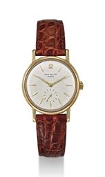PATEK PHILIPPE. AN 18K GOLD AUTOMATIC WRISTWATCH