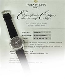 PATEK PHILIPPE. A PLATINUM AUTOMATIC ANNUAL CALENDAR WRISTWATCH WITH SWEEP CENTRE SECONDS, POWER RESERVE AND MOON PHASES