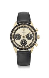 Rolex. A fine, rare and attractive 18K gold chronograph wristwatch with Paul Newman dial
