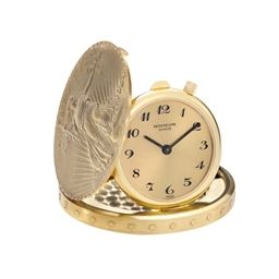 PATEK PHILIPPE. A FINE AND RARE 18K GOLD TWENTY DOLLAR COIN WATCH