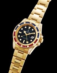 ROLEX. A FINE AND RARE 18K GOLD, DIAMOND, RUBY AND SAPPHIRE-SET AUTOMATIC DUAL TIME WRISTWATCH WITH SWEEP CENTRE SECONDS, DATE AND BRACELET