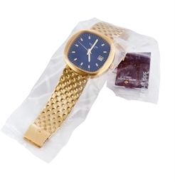 PATEK PHILIPPE. A RARE OVERSIZED 18K GOLD CUSHION-SHAPED ELECTRONIC BRACELET WATCH WITH SWEEP CENTRE SECONDS AND DATE
