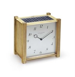 Patek Philippe. A Fine Gilt Brass Square-Shaped Solar Powered Desk Clock