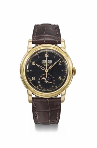 Patek Philippe. An exceptionally important, possibly unique and previously unknown 18K gold perpetual calendar wristwatch with sweep centre seconds, moon phases, black luminous military-style dial, luminous Alpha hands, engraved case back, formerly the pr