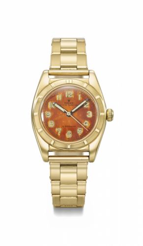 Rolex. A fine and very rare 18K gold automatic wristwatch with sweep centre seconds, tropical luminous dial and bracelet