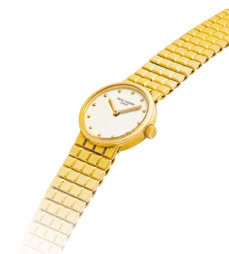 PATEK PHILIPPE. A LADY/bb’/bbS 18K GOLD BRACELET WATCH/b