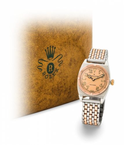 ROLEX. A RARE STAINLESS STEEL AND TONNEAU-SHAPED WRISTWATCH WITH PINK DIAL 