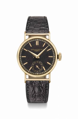 Patek Philippe. A fine and rare 18K gold wristwatch with black dial