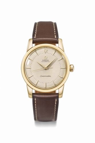 Omega. A fine and attractive 18K gold automatic wristwatch with sweep centre seconds and honeycomb dial