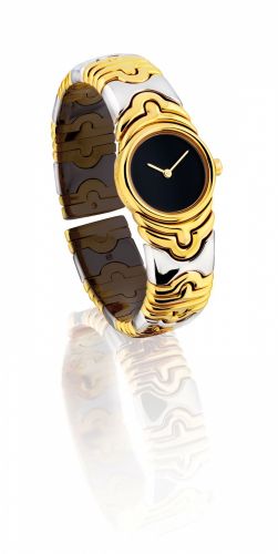 BULGARI. A LADY'S 18K GOLD AND STAINLESS STEEL BANGLE-WATCH