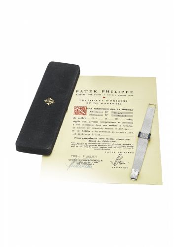 PATEK PHILIPPE. A VERY FINE AND ELEGANT 18K WHITE GOLD, DIAMOND AND SAPPHIRE-SET RECTANGULAR BRACELET WATCH WITH CONCEALED DIAL, ORIGINAL CERTIFICATE AND BOX/bb