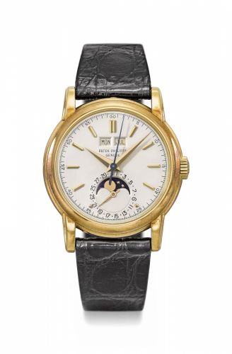 Patek Philippe. A very fine and extremely rare 18K gold perpetual calendar wristwatch with sweep centre seconds, moon phases and screw back