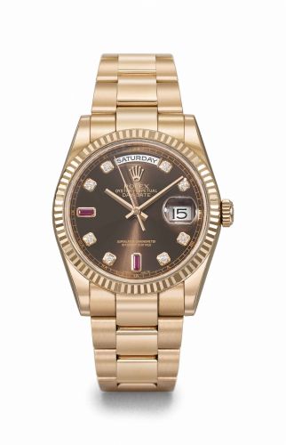 Rolex. A very fine and attractive 18K pink gold diamond and ruby-set automatic wristwatch with day, date, sweep centre seconds, original guarantee and box