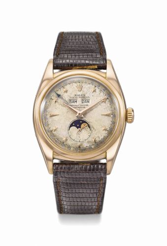 Rolex. An extremely rare and early, attractive and important 18K pink gold automatic triple calendar wristwatch with moon phases and star dial