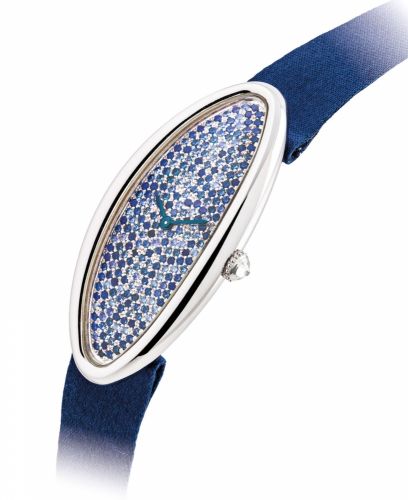CARTIER. A LADY’S FINE AND ELEGANT 18K WHITE GOLD, SAPPHIRE AND DIAMOND-SET ELONGATED OVAL WRISTWATCH