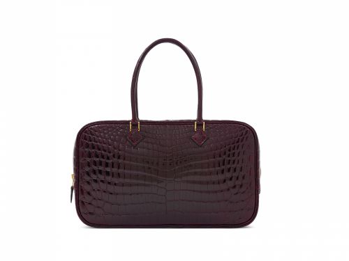 A SHINY BORDEAUX NILOTICUS CROCODILE PLUME ÉLAN WITH GOLD HARDWARE