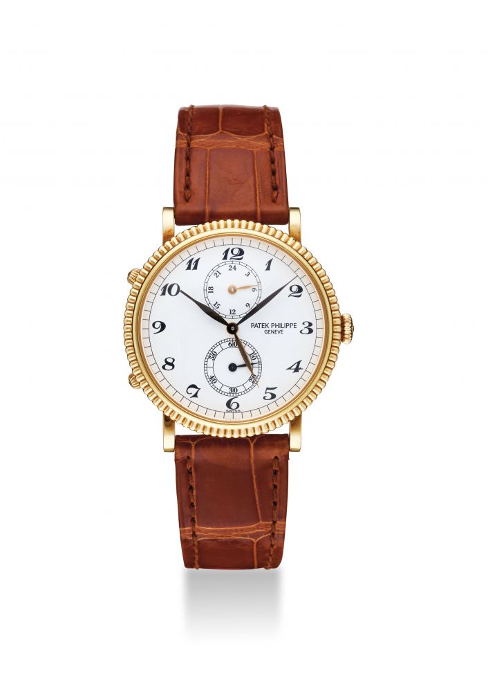 PATEK PHILIPPE. A FINE AND RARE 18K GOLD DUAL TIME WRISTWATCH WITH 24 HOUR INDICATION AND BREGUET NUMERALS