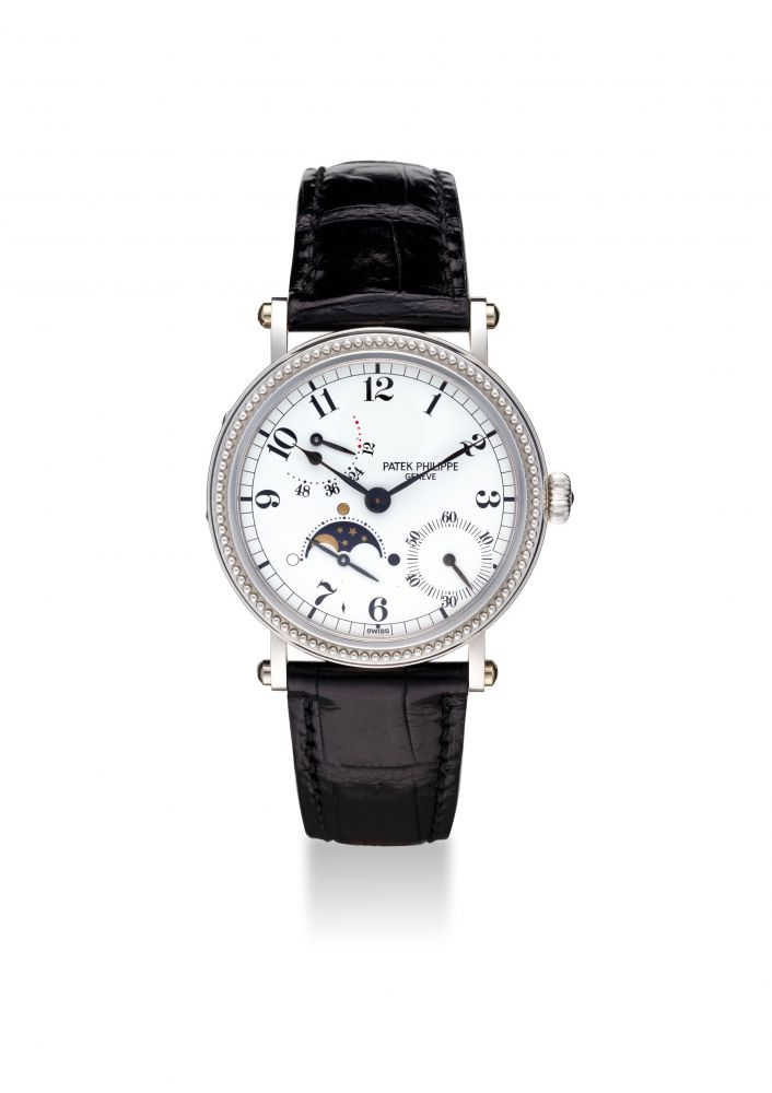 PATEK PHILIPPE. AN ATTRACTIVE AND FINE PLATINUM SELF-WINDING WRISTWATCH WITH POWER RESERVE, ECCENTRIC SUBSIDIARY SECONDS AND MOON PHASES