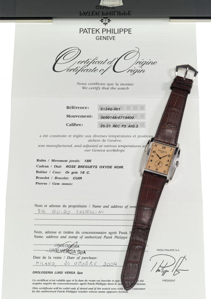 PATEK PHILIPPE. AN ATTRACTIVE AND FINE WHITE GOLD TONNEAU-SHAPED WRISTWATCH WITH ROSE DIAL, BREGUET NUMERALS, ORIGINAL CERTIFICATE AND BOX