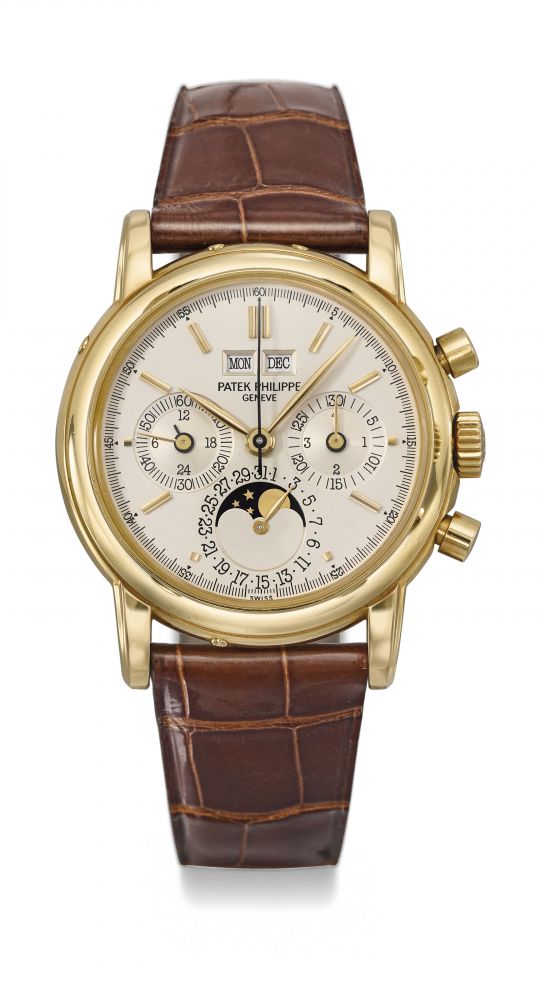 Patek Philippe. A very fine and rare 18K gold perpetual calendar chronograph wristwatch with moon phases, 24 hour and leap year indication