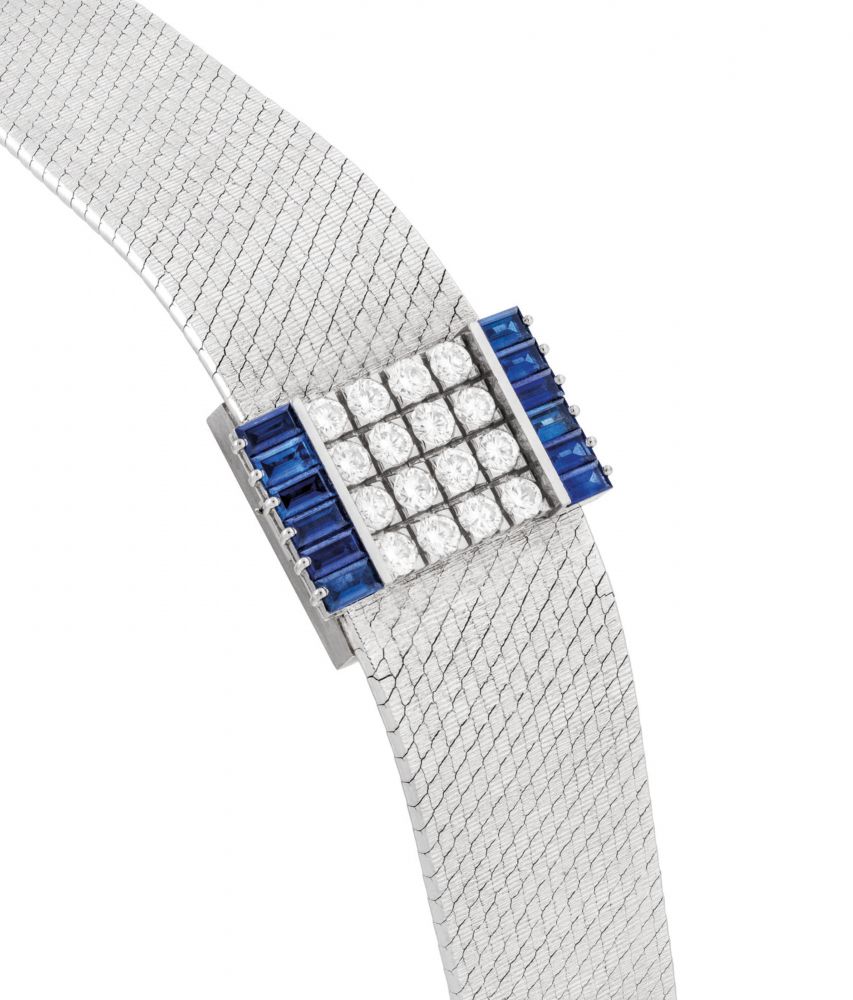 PATEK PHILIPPE. A LADY'S FINE, VERY RARE AND ELEGANT 18K WHITE GOLD, DIAMOND AND SAPPHIRE-SET RECTANGULAR BRACELET WATCH WITH CONCEALED DIAL