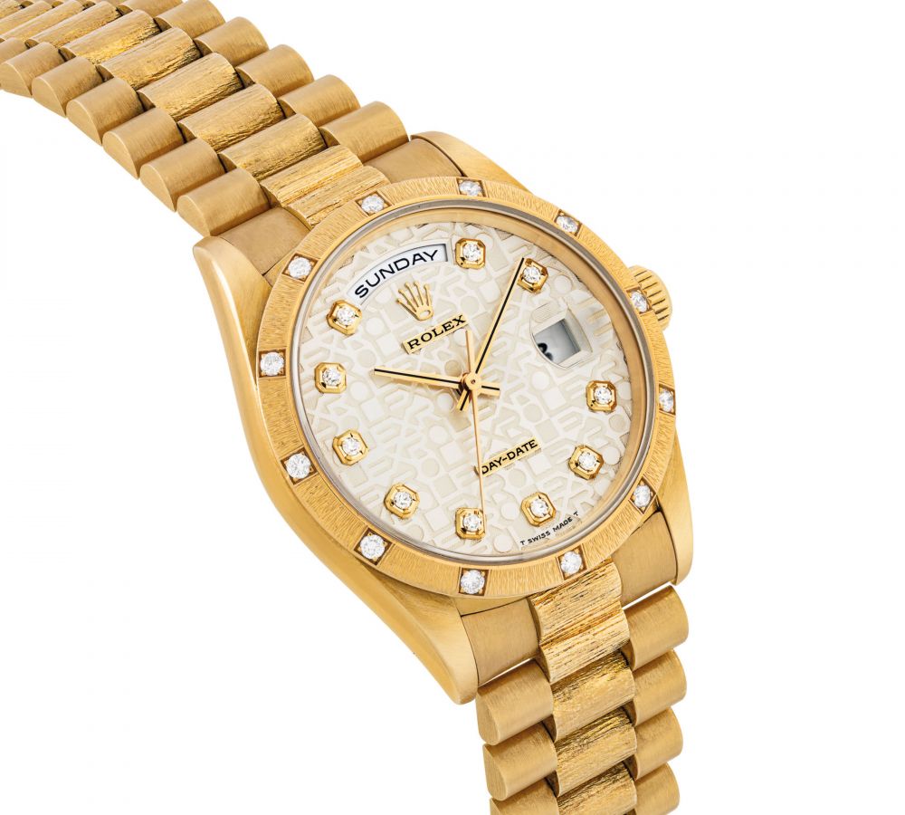 ROLEX. A RARE AND ATTRACTIVE 18K GOLD AND DIAMOND-SET WRISTWATCH WITH SWEEP CENTRE SECONDS, DAY, DATE AND BRACELET