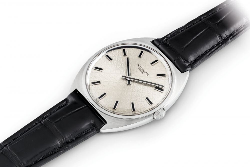 PATEK PHILIPPE. A FINE STAINLESS STEEL TONNEAU-SHAPED WRISTWATCH
