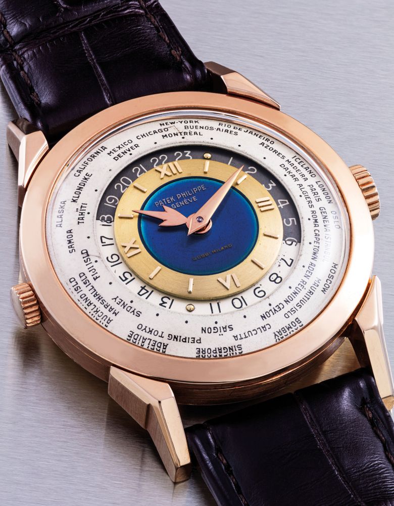 PATEK PHILIPPE. AN EXCEPTIONAL, UNIQUE AND HIGHLY IMPORTANT 18K PINK GOLD TWO-CROWN WORLD TIME WRISTWATCH WITH 24 HOUR INDICATION AND DOUBLE-SIGNED BLUE ENAMEL DIAL