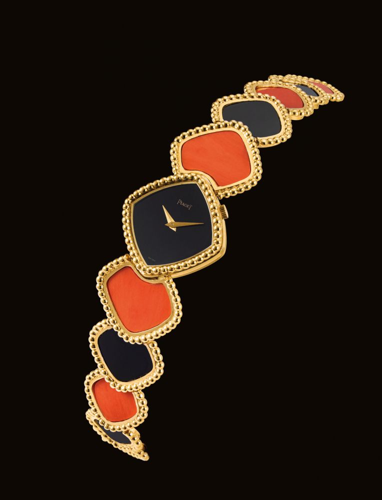 PIAGET. A LADY'S FINE, RARE AND ATTRACTIVE 18K GOLD, CORAL AND ONYX-SET BRACELET WATCH