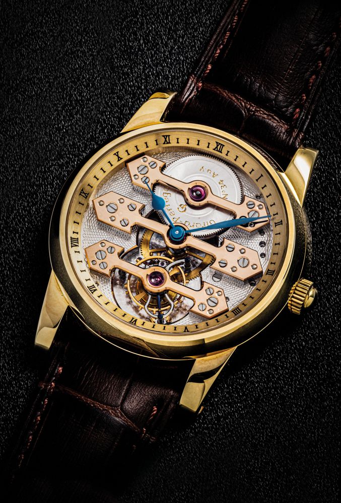 GIRARD-PERREGAUX. A FINE AND RARE 18K GOLD TOURBILLON WRISTWATCH WITH THREE GOLD BRIDGES