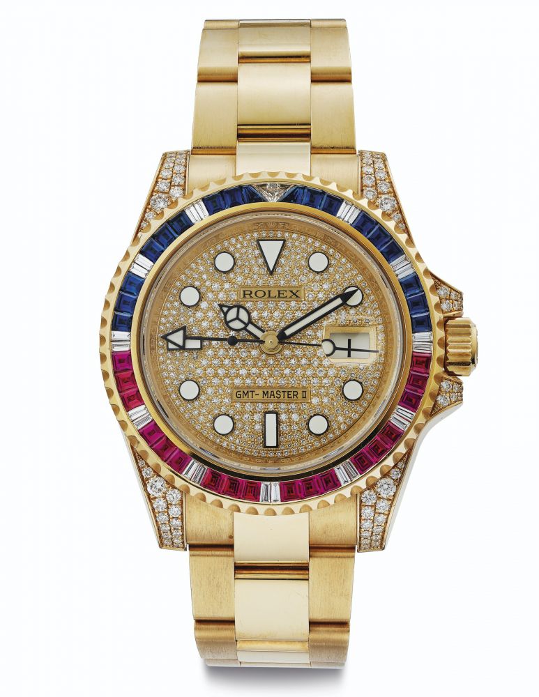 Rolex. A Very Fine and Rare 18k Gold, Diamond, Sapphire and Ruby-Set Automatic Dual-Time Wristwatch with Center Seconds, Date and Bracelet