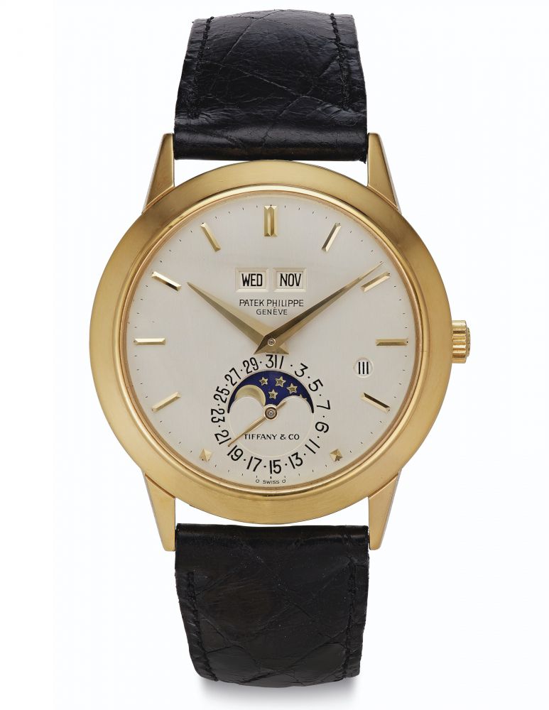 Patek Philippe. A Very Fine and Rare 18k Gold Automatic Perpetual Calendar Wristwatch with Moon Phases and Leap Year Indication