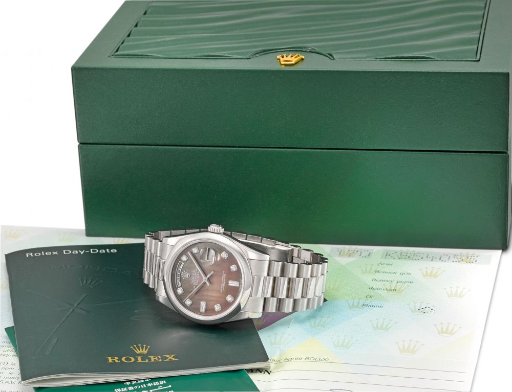 ROLEX. A VERY FINE AND RARE PLATINUM AUTOMATIC WRISTWATCH WITH SWEEP CENTRE SECONDS, DAY, DATE, BLACK DIAMOND-SET MOTHER-OF-PEARL DIAL, BRACELET, ORIGINAL GUARANTEE AND BOX