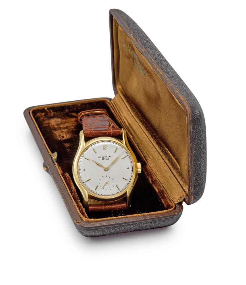 PATEK PHILIPPE. A FINE AND RARE 18K GOLD WRISTWATCH WITH BOX