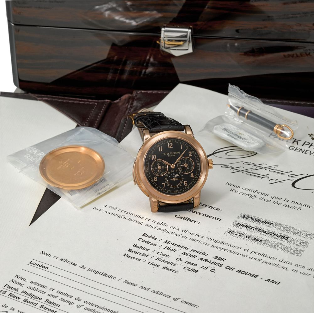 Patek Philippe. A very fine and rare 18K pink gold automatic minute repeating perpetual calendar wristwatch with moon phases, 24-hour indication, additional solid case back, original certificate and box