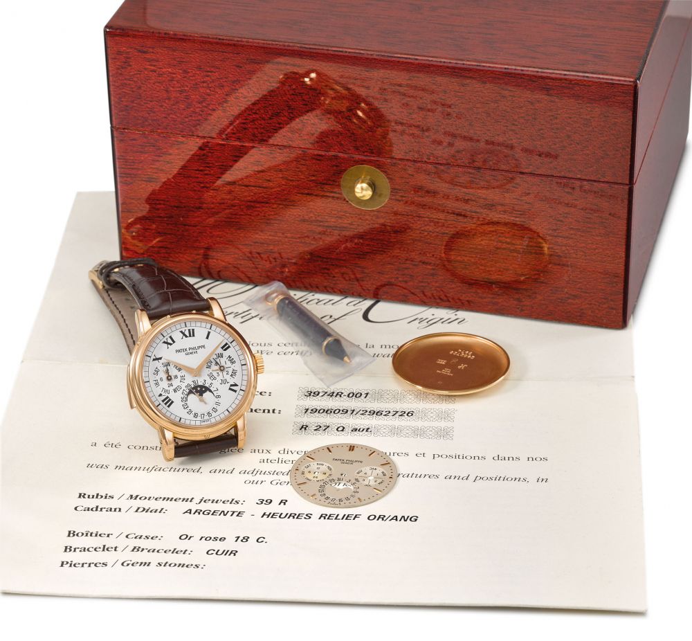 Patek Philippe. An extremely fine, rare and important 18K pink gold automatic minute repeating perpetual calendar wristwatch with phases of the moon, additional white Roman dial, regular dial, case back, original certificate and box