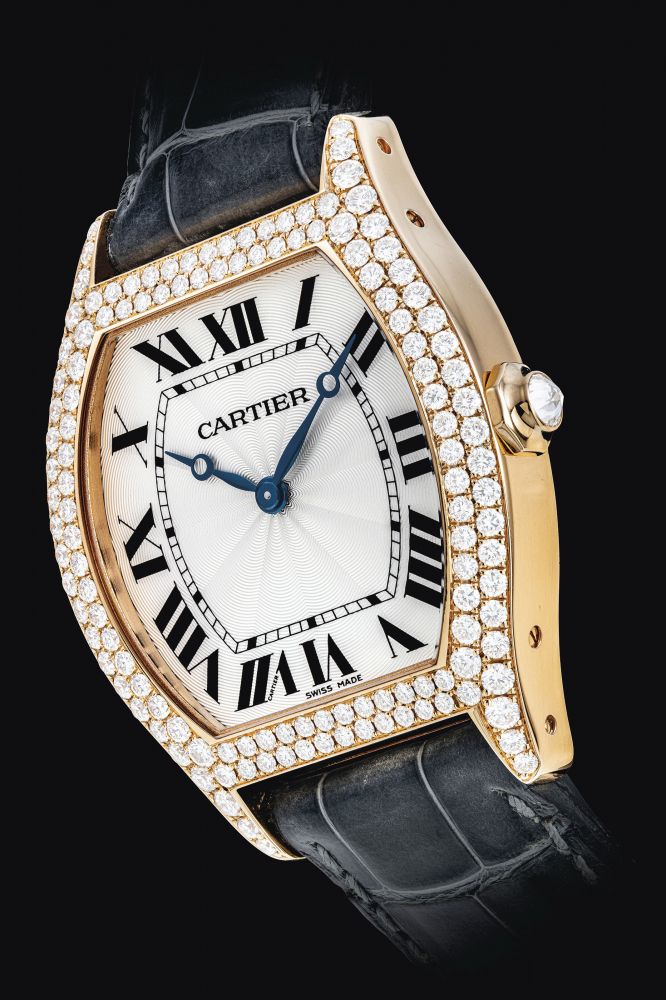 CARTIER. AN ATTRACTIVE 18K PINK GOLD AND DIAMOND-SET TONNEAU-SHAPED WRISTWATCH