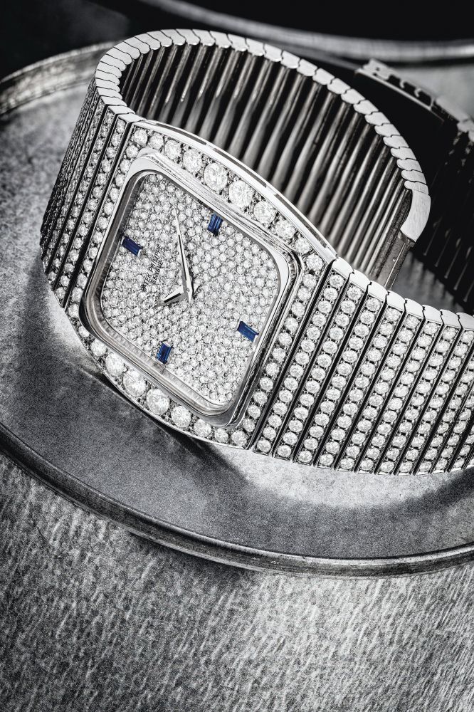 PATEK PHILIPPE. AN 18K WHITE GOLD, DIAMOND AND SAPPHIRE-SET BRACELET WATCH