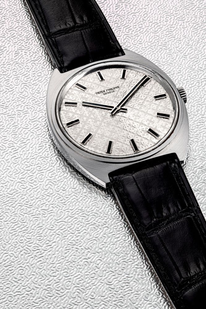 PATEK PHILIPPE. A STAINLESS STEEL TONNEAU-SHAPED WRISTWATCH