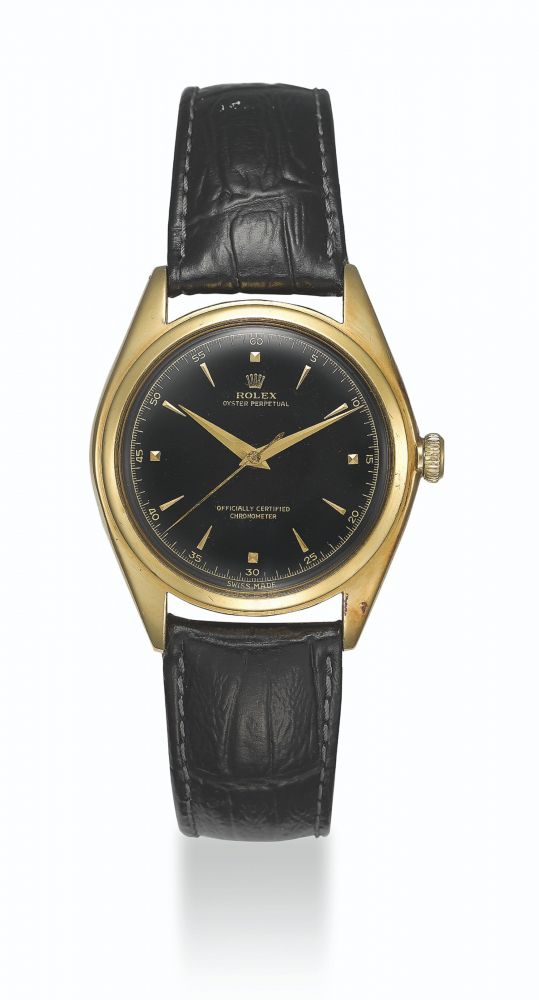 ROLEX, GOLD BUBBLE BACK WITH BLACK LACQUERED DIAL, REF. 5028 - CASE NO. 675’089