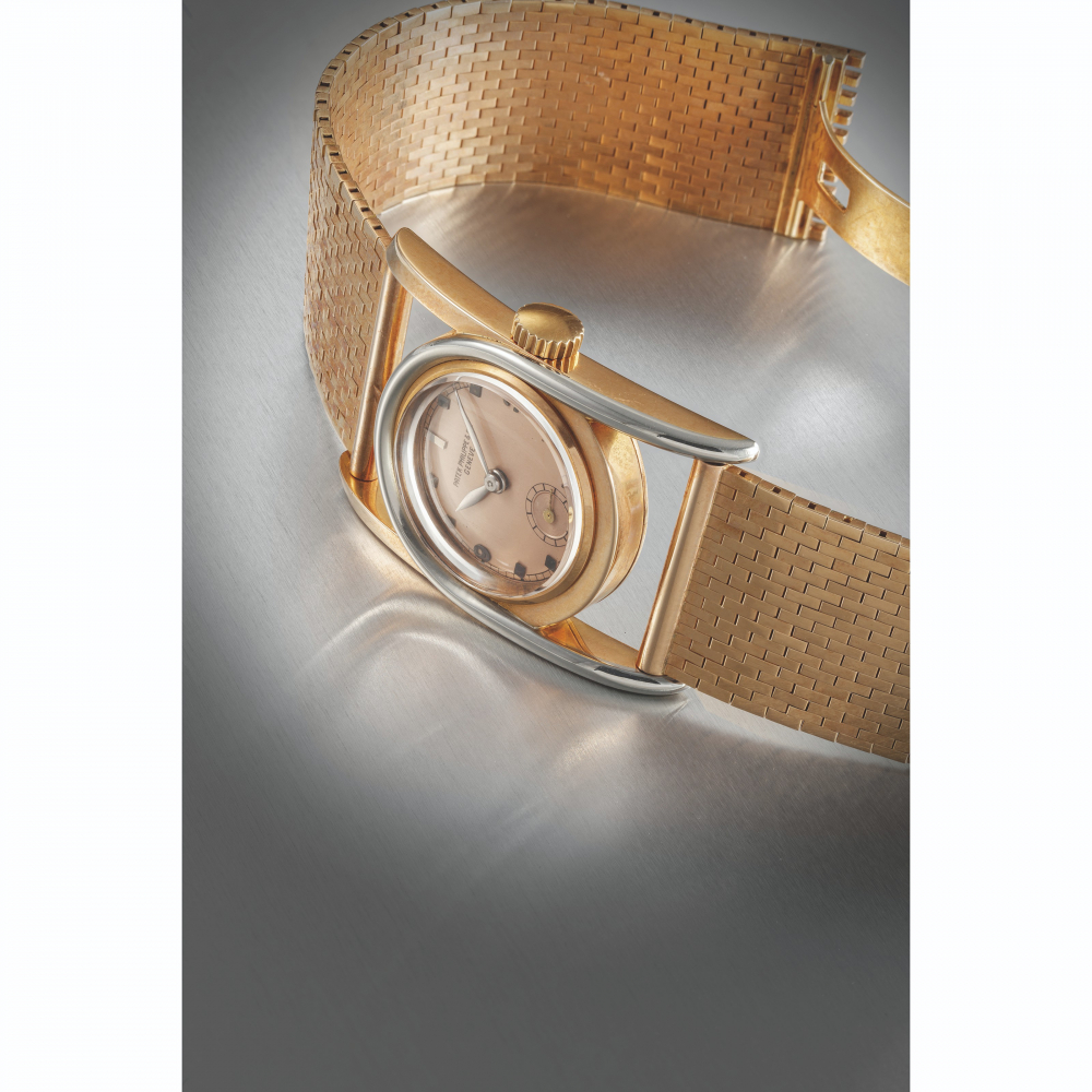 PATEK PHILIPPE. A RARE 18K PINK GOLD AND WHITE GOLD WRISTWATCH WITH 14K PINK GOLD ASSOCIATED MATCHING CARTIER BRACELET