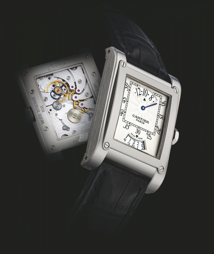 CARTIER. A FINE 18K WHITE GOLD RECTANGULAR WANDERING HOUR WRISTWATCH WITH DATE