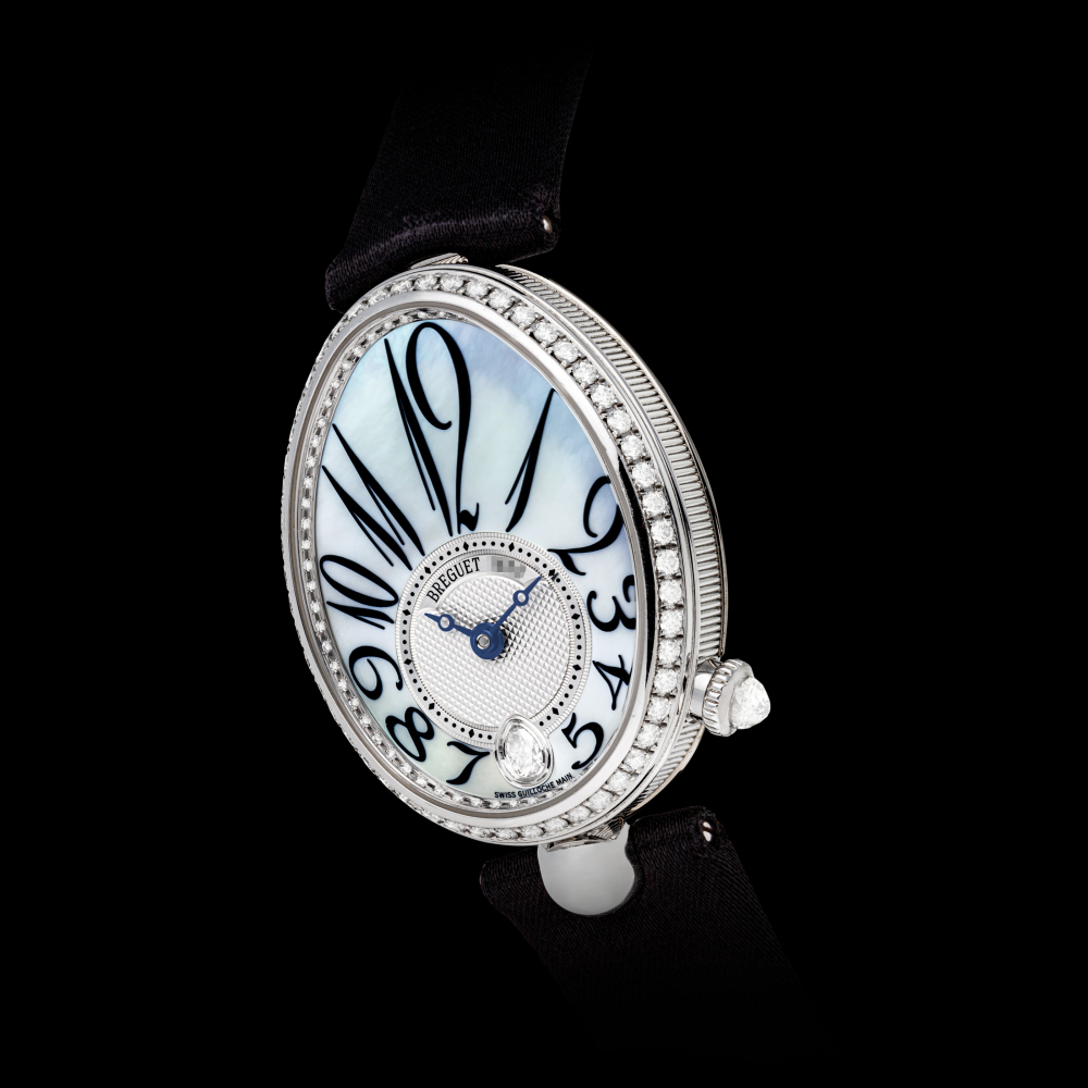 BREGUET. A LADY’S FINE 18K WHITE GOLD AND DIAMOND-SET AUTOMATIC OVOID-SHAPED WRISTWATCH WITH MOTHER-OF-PEARL DIAL