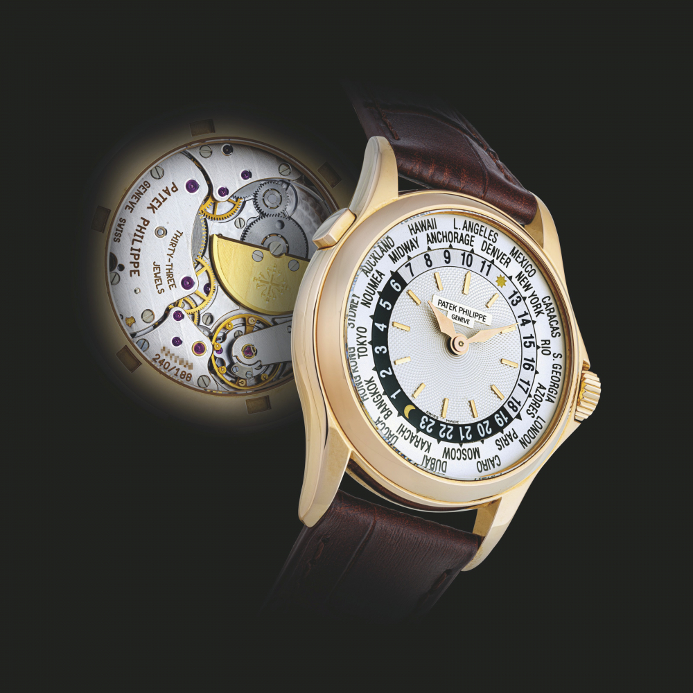 PATEK PHILIPPE. AN 18K PINK GOLD AUTOMATIC WORLD TIME WRISTWATCH