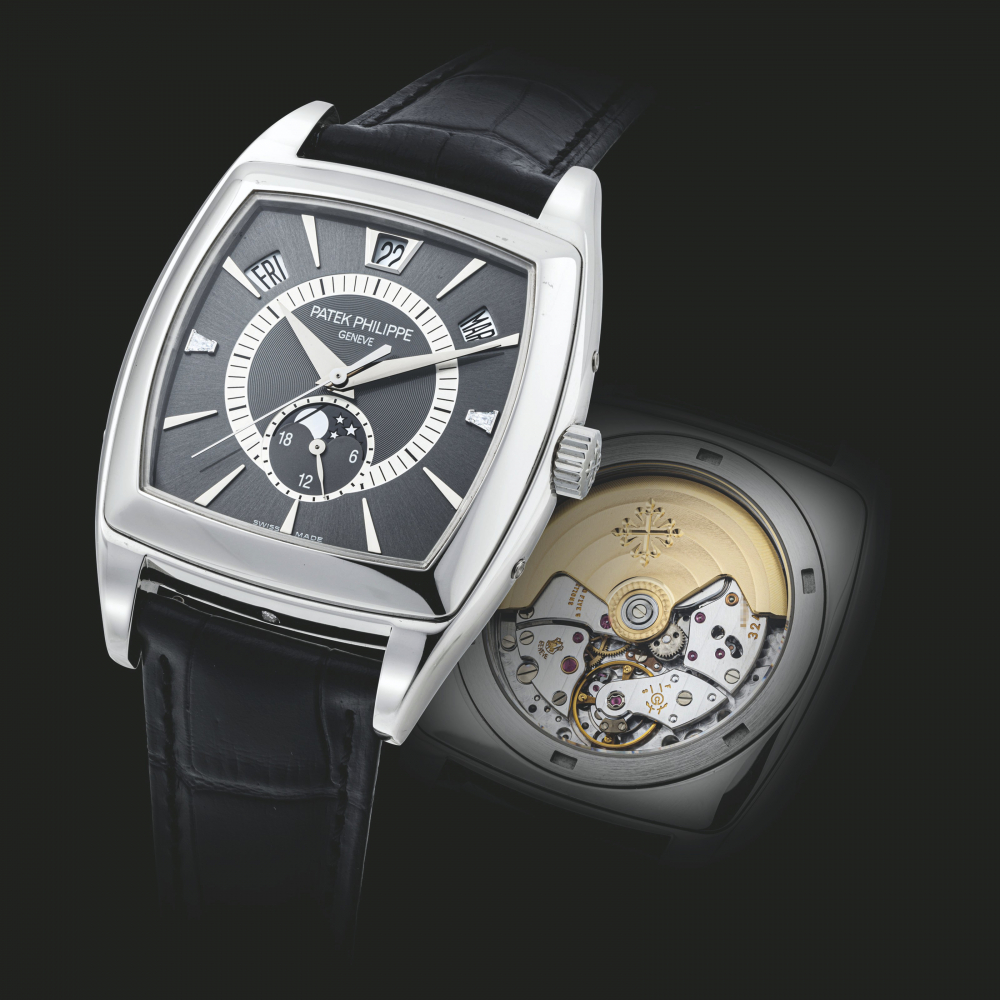PATEK PHILIPPE. A PLATINUM AND DIAMOND-SET AUTOMATIC ANNUAL CALENDAR WRISTWATCH WITH SWEEP CENTRE SECONDS, 24 HOUR INDICATION AND MOON PHASES