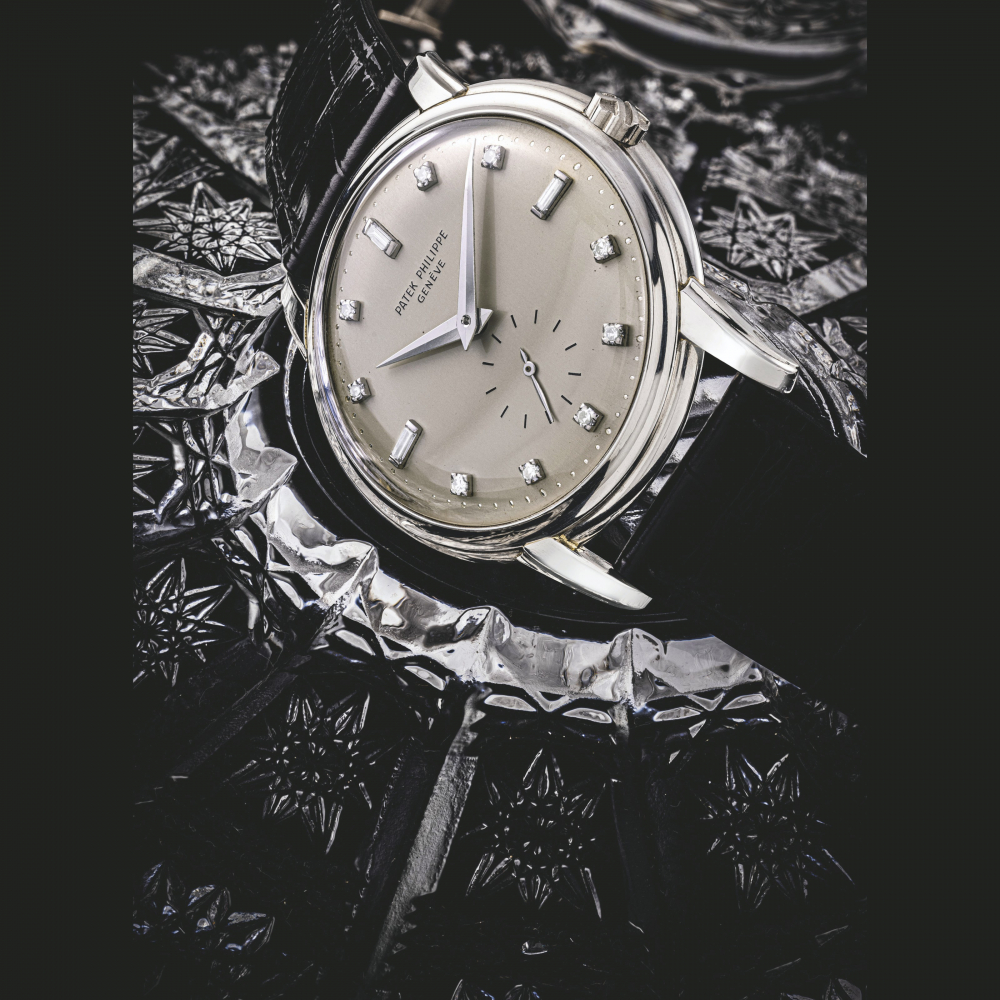 PATEK PHILIPPE. A VERY RARE PLATINUM AND DIAMOND-SET AUTOMATIC WRISTWATCH